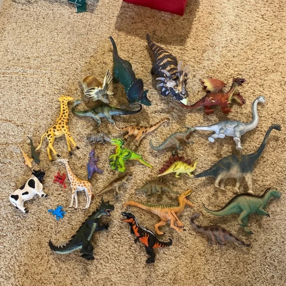 Lot of hard animal toys- mostly dinos